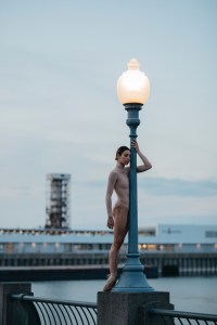 Ballet dancer from Les Grands Ballets next to a lamp post