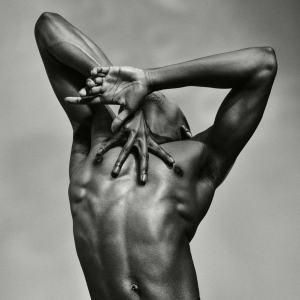 Male ballet dancer from Les Grands Ballets posing in black and white